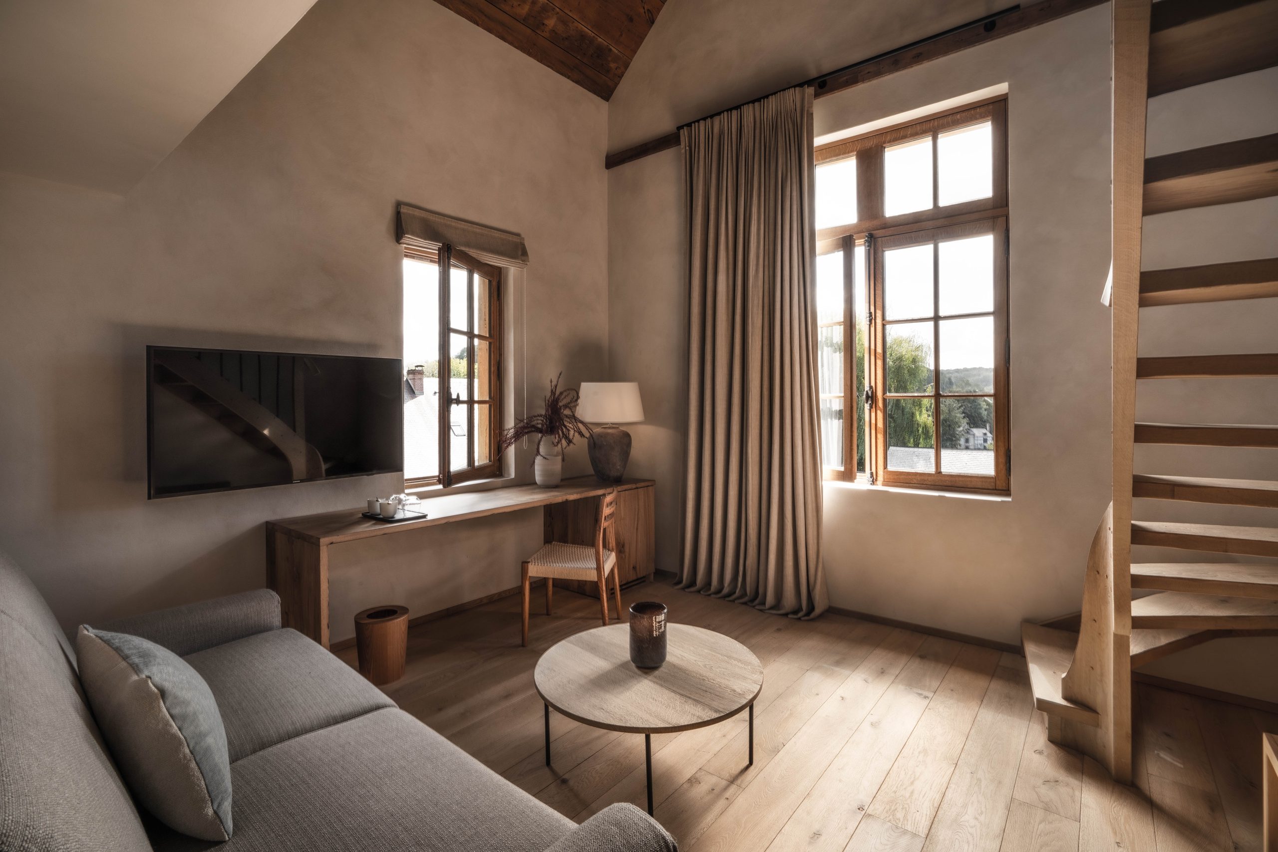 lounge area of the suite with sofa - l'auberge de la source honfleur